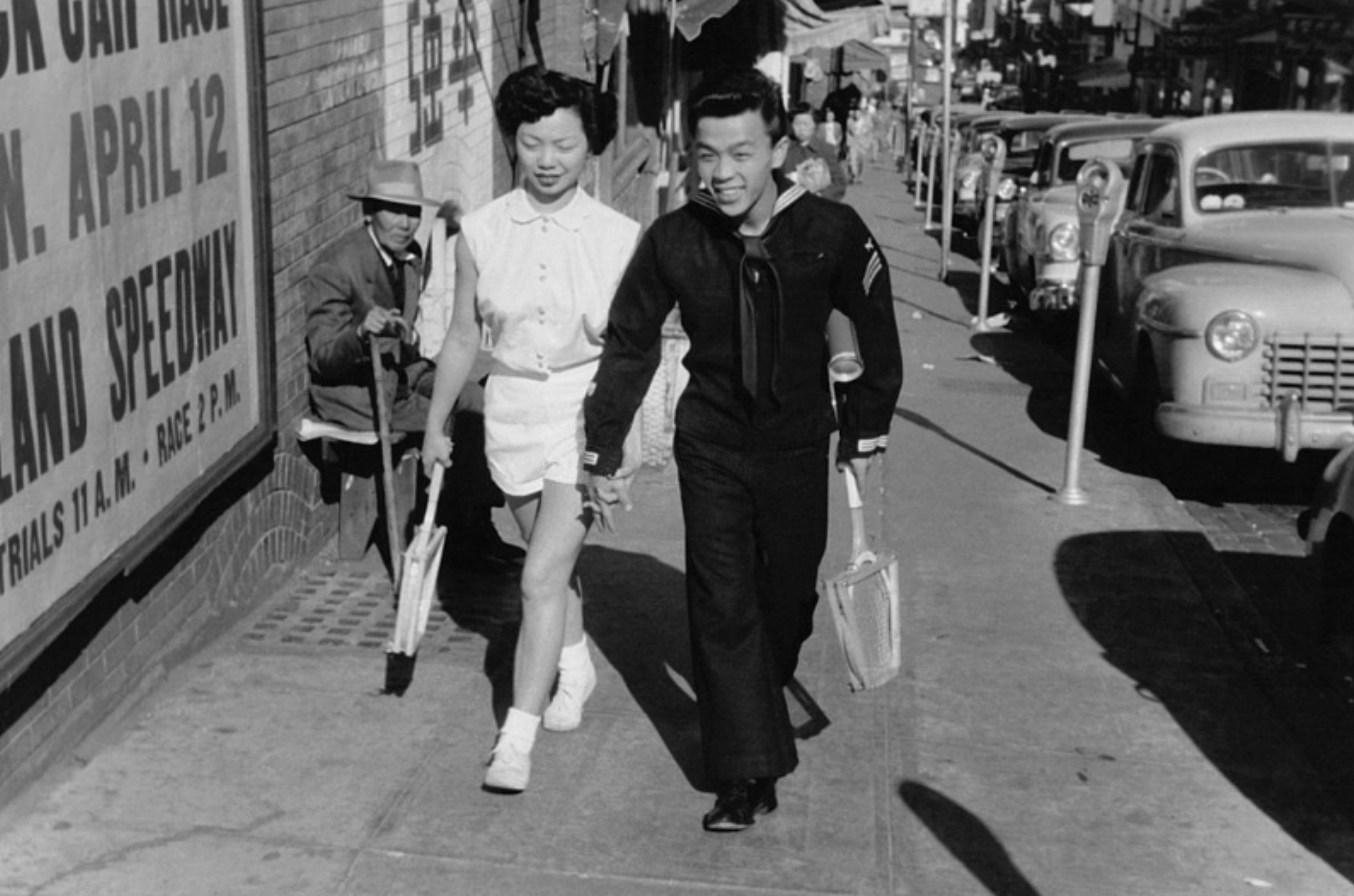 Couple walking on a street in Chinatown, San Francisco, 1953